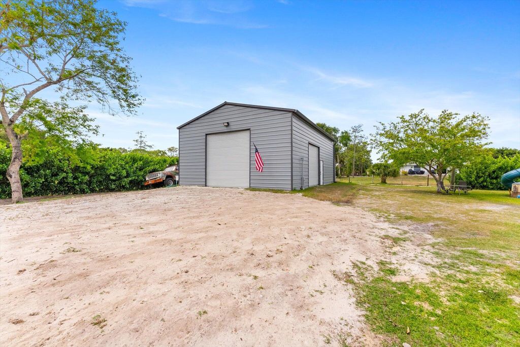 Photo of 17925 32nd Lane N, The Acreage, FL 33470 (MLS # R11083998)