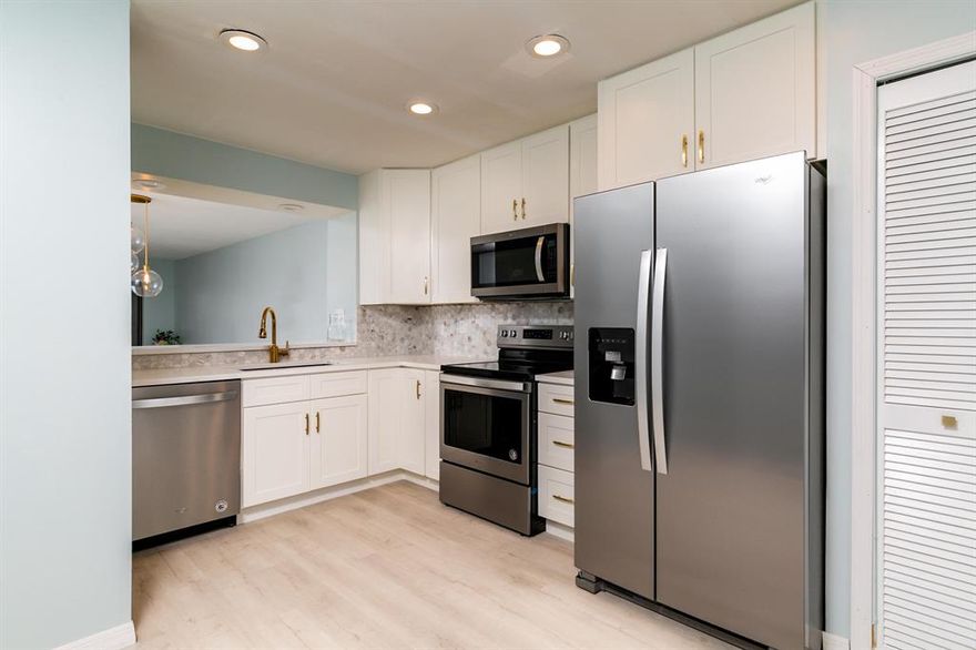 Gorgeous remodeled 2/2 condo in over 55 community minutes from the Stuart beaches and charming downtown shops/restaurants. Garage parking, washer/dryer in each unit.
Designer kitchen with granite, tile backsplash, brand new stainless steel appliances. Wood like flooring & newly painted interior with soft tones thru out, enclosed patio overlooking a peaceful fountain & pool. Community heated pool.