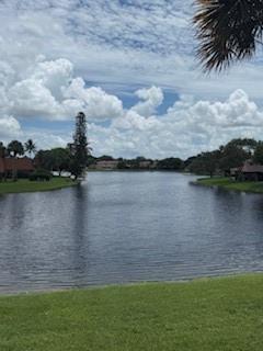 STUNNING LAKEFRONT TOWNHOUSE! This beautiful 2 bedroom, 2 bathroom home with a versatile den offers an ideal blend of style and comfort. Enjoy tranquil lake views from your living space and from the private courtyard. The marble floors enhance the beauty of the gourmet kitchen, livingroom and den. The spacious primary suite features an ample walk in closet and a smaller walk in closet plus a luxurious bathroom. The den can easily serve as a home office, guest space or hobby room. Located in a desirable community with easy access to shopping, dining and major highways. Move in ready. Your lakefront lifestyle awaits!