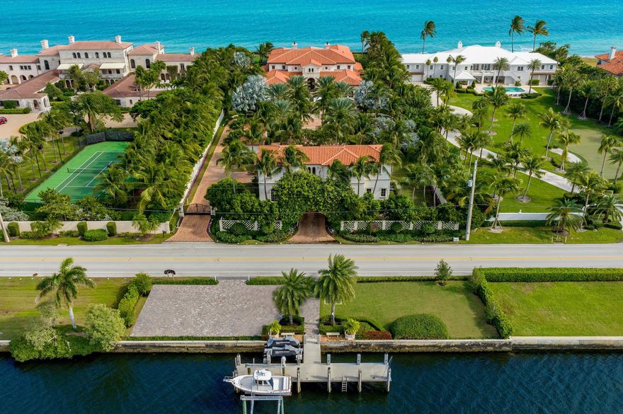 Spectacular Ocean-to-Lake Light and Bright Modern Mediterranean Compound with 9BR/11.3BA and 150 feet +/- of Ocean and Intracoastal frontage. This one-of-a-kind estate features rich details, intricate millwork, and sophisticated finishes. From spectacular reception to oversized living spaces and gorgeous formal dining room, this home is perfect for entertaining. Stunning wrought iron entryway opens to welcoming foyer with sweeping, detailed ceilings, beautiful imperial staircase, and crystal chandelier. Pristine estate with great natural sunlight throughout. Eat-in kitchen with island, china and silverware closet, and butler's pantry. Fabulous theater room connects to pub room with full bar. Paneled library with detailed fireplace. Expansive second floor primary wing with fireplace, dual baths, walk-in closets, and striking ocean views. Finished basement features air-conditioned 12+ car garage and temperature-controlled wine cellar with wet bar and tasting table. Fantastic guest house with two bedrooms, kitchenette, washer and dryer, and elevator. Full staff house with two bedrooms and kitchen. Deep water concrete dock. Oversized oceanfront columned loggia with summer kitchen, al fresco dining, TV, and fireplace. With covered balcony, open balcony, fountain, and pool, this Estate is perfect for outdoor living.
