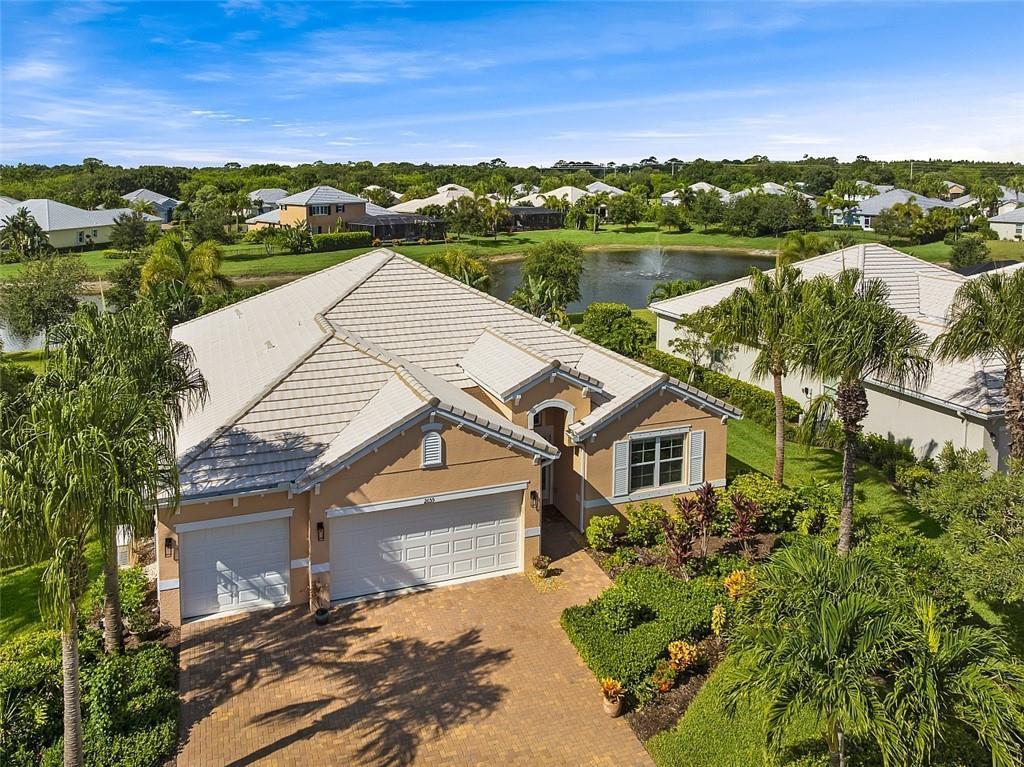 Wake up to sparkling lakefront fountain views and unwind on your screened lanai--Florida living at its best! This beautifully maintained 3BR/3BA home with a 3-car garage sits on a serene lakefront lot in one of Vero Beach's most sought-after communities. The triple split floor plan offers exceptional privacy, while the open kitchen features an oversized island, upgraded cabinetry, stainless appliances, and granite counters--perfect for entertaining. Upgrades include crown molding, tile throughout, and a whole-house generator. Enjoy lush landscaping, space for a pool, and resort-style amenities: heated pool, spa, fitness center, tennis, and clubhouse. Minutes to beaches, dining, and shopping, this home blends elegance, comfort, and location in one perfect package.