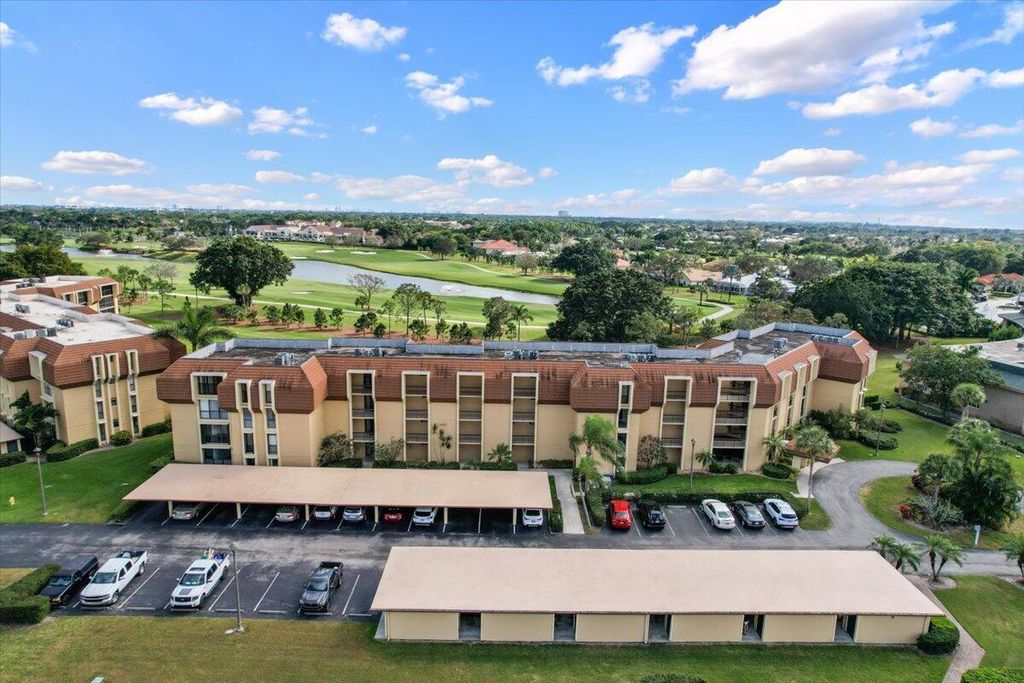 Photo of 5390 Woodland Lakes Drive #106, Palm Beach Gardens, FL 33418 (MLS # R10867573)