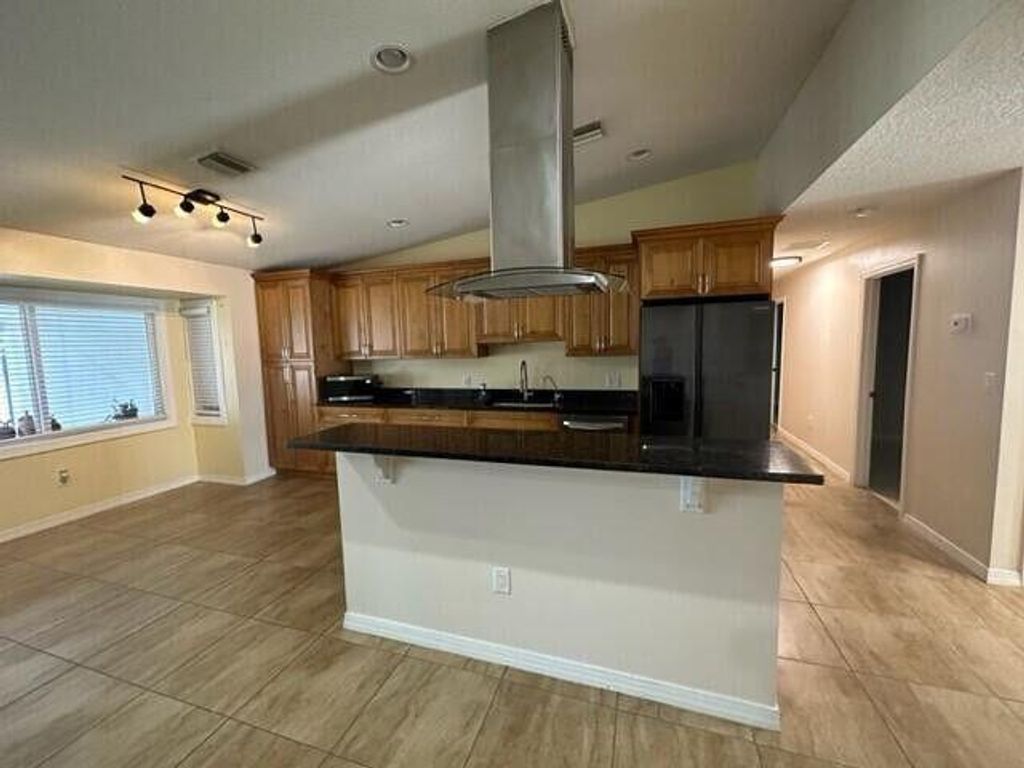 Photo of 1077 Fernlea Drive, West Palm Beach, FL 33417 (MLS # R11160140)