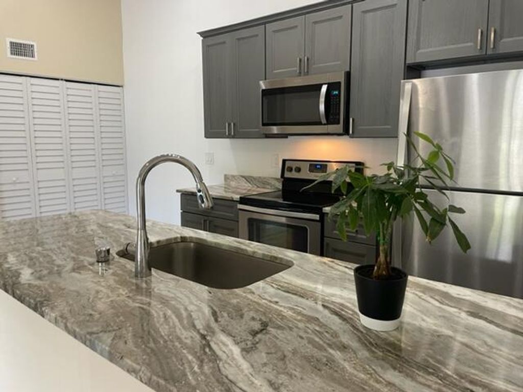 Photo of 6313 Chasewood F Drive Dr #F, Jupiter, FL 33458 (MLS # R10816028)