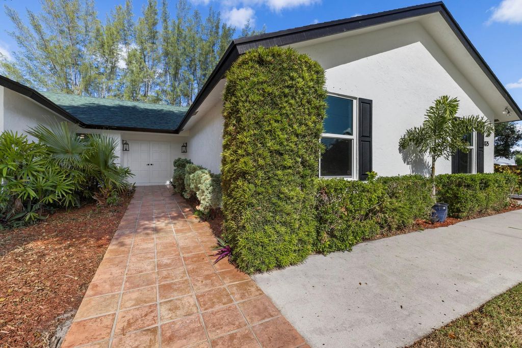 Photo of 825 Whippoorwill Trail, West Palm Beach, FL 33411 (MLS # F10530005)