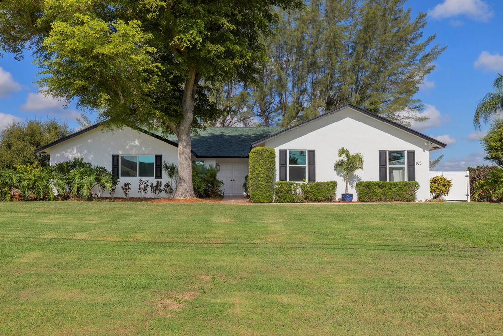 Photo of 825 Whippoorwill Trail, West Palm Beach, FL 33411 (MLS # F10530005)
