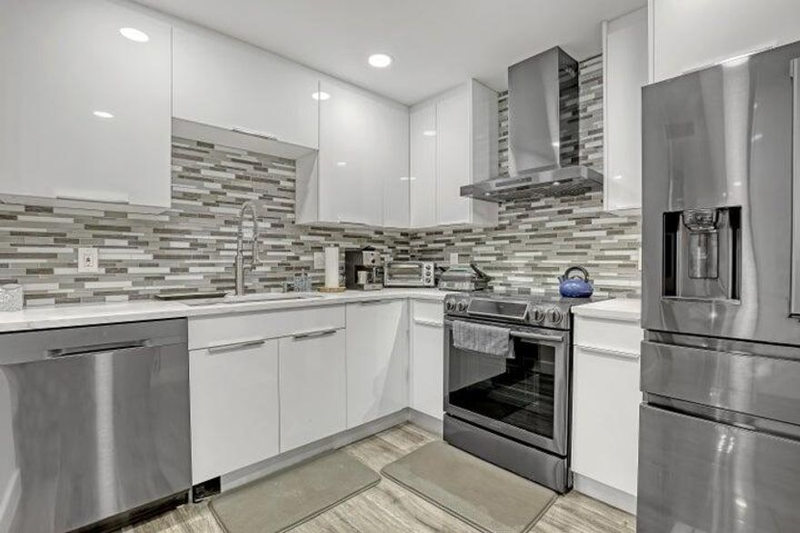 ONE OF THE MOST BEAUTIFUL UPGRADED UNIT IN BLDG W/DECORATOR TOUCHES.  SPACIOUS ONE BEDROOM 1-1/2 BATHS.  LOVELY SUNSET VIEWS  W/D IN UNIT. FULL AMENITY BLDG W/2 POOLS, ACROSS FROM FABULOUS BEACH.  24 HR DOORPERSON.