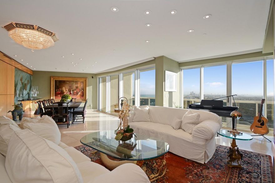 PENTHOUSE FLOOR, HIGH CEILINGS WITH UNOBSTRUCTED VIEW OF THE OCEAN AND CITY SKYLINE . LARGEST CURRENTLY AVAILABLE 2 BEDROOM 2 .5 BATH TOTALLY 2690 SQ FT.ENTER PH UNIT IN A PRIVATE ELEVATOR DIRECTLY INTO YOUR OWN FOYER, OPENING TO A  LARGE LIVING AREA WITH COSTUMED FITTED BAR AREA, EXTENSIVE DINNING AREA WITH A FLOW TO THE LIVING AREA. RESIGNED FLOOR PLAN FROM ORIGINAL MODEL. MAJESTIC TOWER IS LOCATED IN THE HEART OF BAL HARBOR ACROSS THE STREET TO THE FAMOUS BAL HARBOUR MALL, THIS RESORT STYLE CONDO FEATURES  BEACH SERVICES, POOL, GYM, TENNIS AND A BASKETBALL COURT,SPA,ONSITE RESTAURANT, BILLIARDS, CARD RM ,VALET, CONCIERGE. UNIT IS COMPLETE WITH AUTOMATIC HURRICANE SHUTTERS AND 2 DESIGNATED PARKING SPACES.