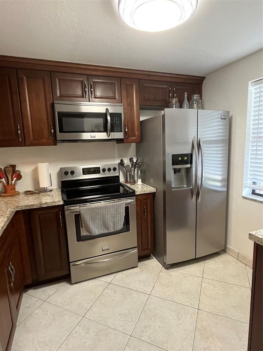 Welcome home to your beautiful turn key condo in the highly sought after 55+ community of Sunrise Lakes Phase 4! This beautiful lakefront condo boasts water views from both your screened in balcony & master bedroom. The master bedroom features a large walk-in closet and en-suite bathroom. Your washer and dryer are located inside the unit. You also have extra storage outside the unit. Enjoy peace of mind with accordion shutters installed on all windows & balcony. Plenty of guest parking! Enjoy a luxurious lifestyle w/ extensive community amenities, featuring golf and tennis facilities, state-of-the-art fitness room, 6 sparkling swimming pools, Relaxing sauna & jacuzzi, movie theater for a cinematic experience, regular concerts, shows, and dances, plus various hobbies and clubs to explore!!!