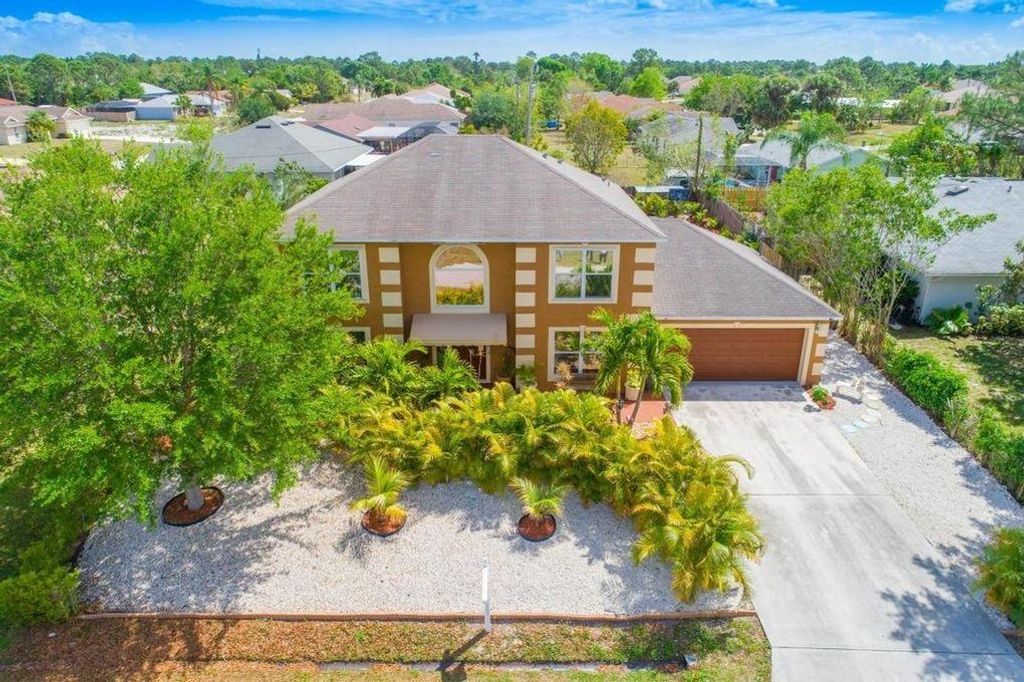 Photo of 3013 SW Bridge Street, Port Saint Lucie, FL 34953 (MLS # R10696357)