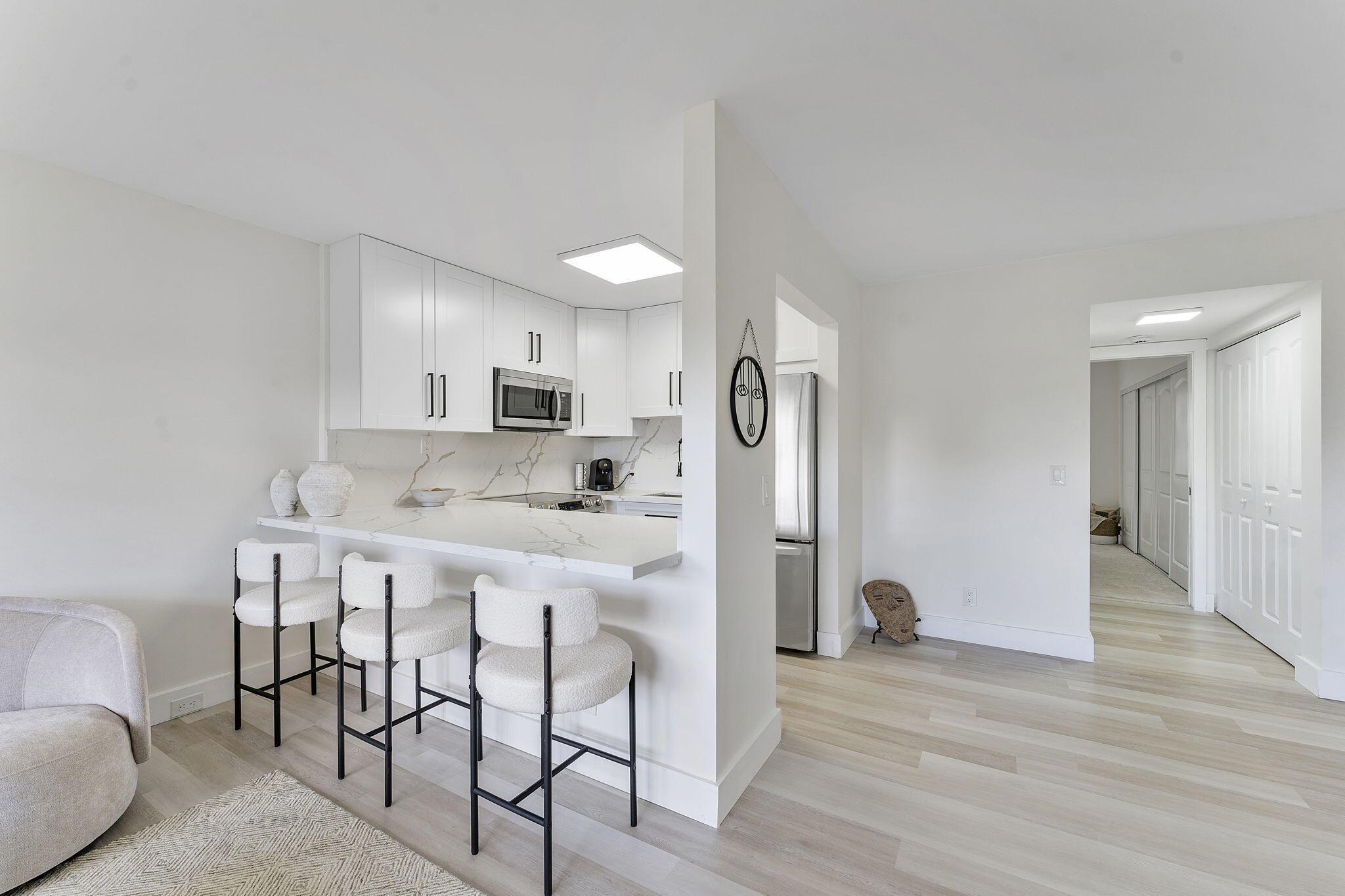 This is your perfect Boca Raton condo--like living in a luxury resort with every amenity you can imagine including a clubhouse, tennis, pickleball, fitness, theater, activities and special interest clubs. Shuttle services to shopping and dining. Move-in condition! Fully renovated with high-end finishes like quartz counter tops, luxury floors, top of the line appliances and more. Recently added new electrical panel and custom closets. Easy access to laundry and elevator. You can enjoy the serene and relaxing garden view from your private balcony.