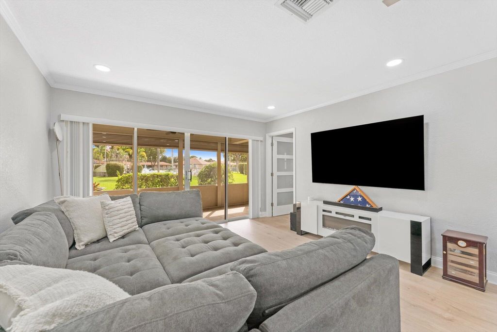 Photo of 703 Whippoorwill Lane, Delray Beach, FL 33445 (MLS # R11133605)