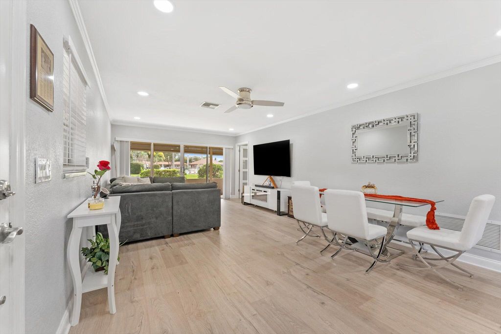 Photo of 703 Whippoorwill Lane, Delray Beach, FL 33445 (MLS # R11133605)