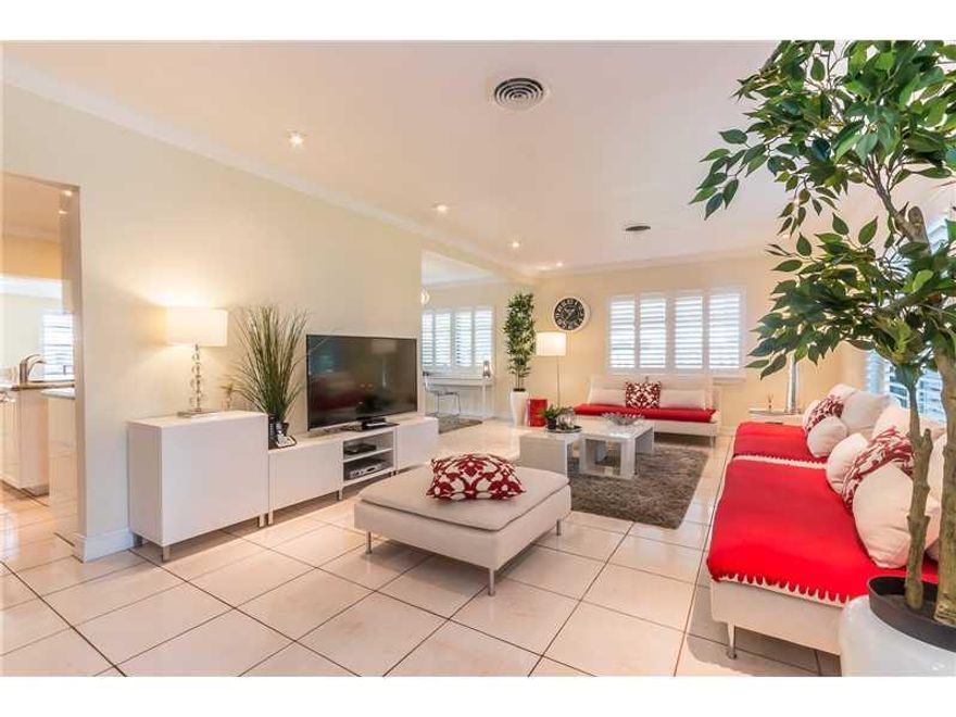 Gorgeous tri-level 4/3 deep water  totally and meticulously remodeled in and out with only the best quality materials (granite, wood floors, and much more). Multi level wood deck and tropical pool with a south exposure are perfect for outdoor entertainmen ts. Extra wide 70' dock, 10,000 lb. boat lift and proximity of the inlet make it a boater's dream! All this so close to the beach! Although the price does not include the furniture, the house could be sold furnished. Easy to show! Call agent for a video.