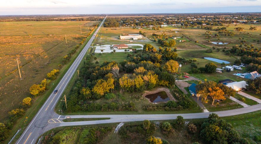 2+ ACRES SW section of Okeechobee.
Buildable lot off Hwy 70 West.
 Build your dream home BARNOMINIUMN with the 60x80 metal building, on site- two-tone dark gray/light gray in color, 4/12 roof 2' eves. 
Engineered house plans included with the purchase of the land for a
 5 bedrooms, 5 and half Baths, two-story home with game room, theater, 2400 sq ft shop/garage. 3600 sq ft living.
 Partially fenced, culverts placed.