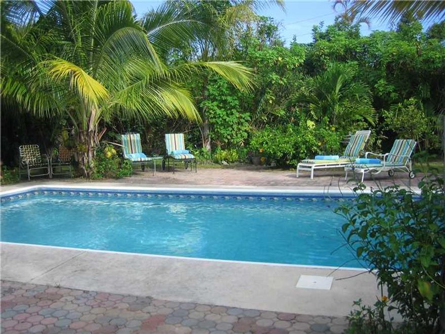 ALERT $$$ IMPACT WINDOWS COMING JAN 2016!!  Florida home with terrazzo floors, 3 beds, 2 baths, & a salt water pool in Central Wilton Manors. Master bedroom has French doors out to the relaxing pool area. Many nice features include a family room, inside l aundry room, circle drive, on a large lot (9,995sf).  New shingle roof Aug 2015 & flat roof new in 2010, Trane AC system new in 2010. Best of all - LOCATION - close to Wilton Drive & all the action but just removed enough to enjoy your tropical paradise.