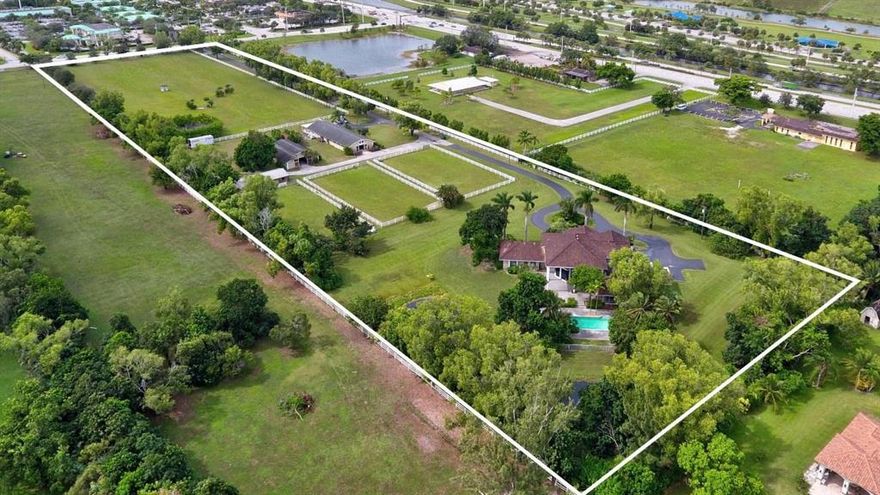 Unique 10 acre show barn that includes grand estate home with lots of extras. Pool, generator, 5 A/C's , high ceilings, gas fireplace and grill. Newer roof with lifetime transferable warranty. With 26 stalls, 3 barns, paddocks, jump field, grooms quarters, this can be a great income producing property. Reasonable trailering to horse shows including WEF. Many options to this one of a kind property including developer opportunity.