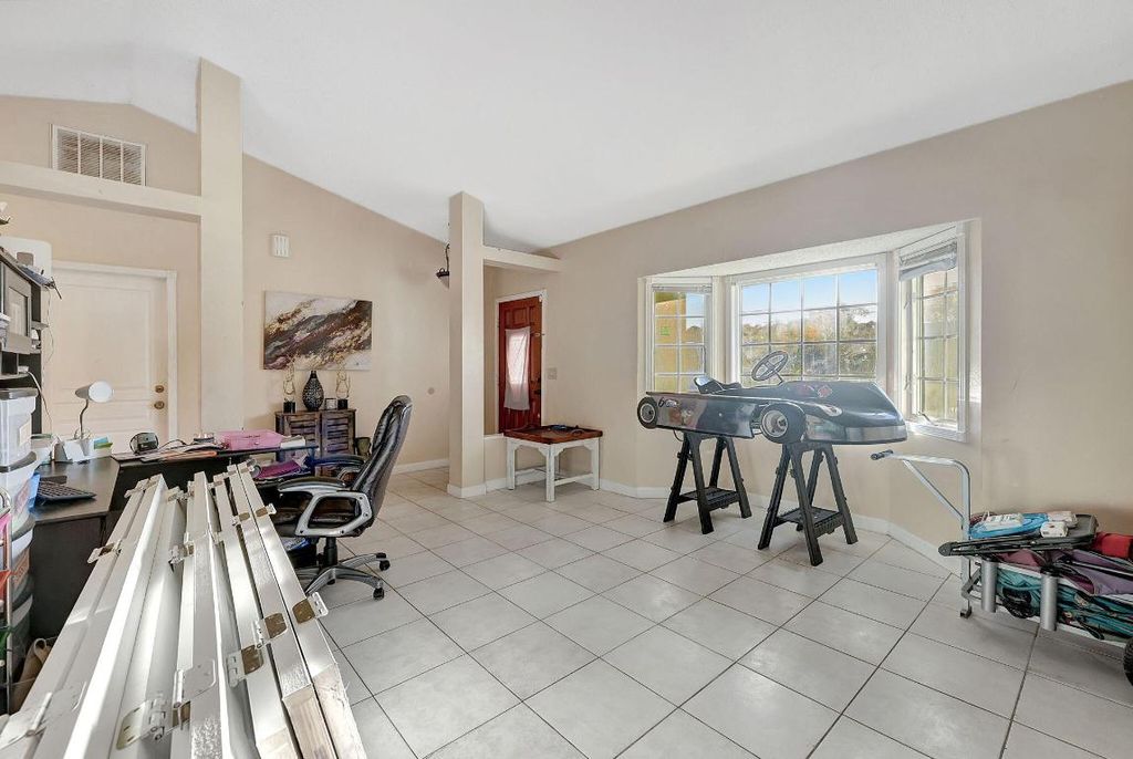 Photo of 3617 SW Masilunas Street, Port Saint Lucie, FL 34953 (MLS # R11156522)