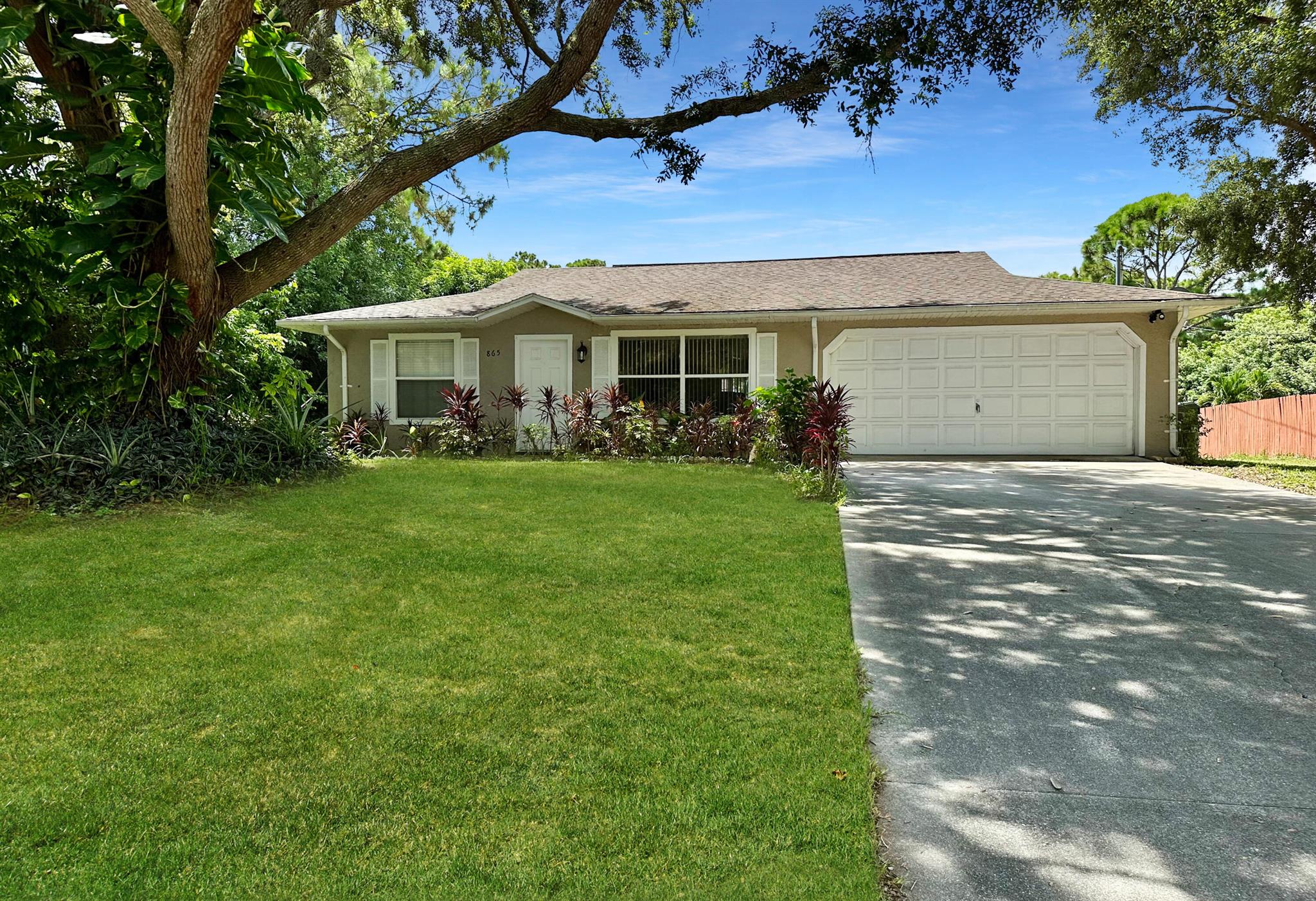 Charming SFH opportunity in Vero Beach, Fl. Bring your visions to create your perfect home. Boasting 1,258 sf, features practical split floor plan & ready for your custom touches. The original roof shelters this home, which includes a convenient 2 car garage + longer driveway, beautiful curb appeal. Functionality in the eat-in kitchen, which opens up to a patio through sliding doors. Primary bedroom offers an en-suite + WIC. Large southern-facing backyard w/patio ready for your family, friends & pets. Near beaches & schools. Ask your agent for details regarding insurability & financing. Room size apprx sub to error. Buyer due diligence.