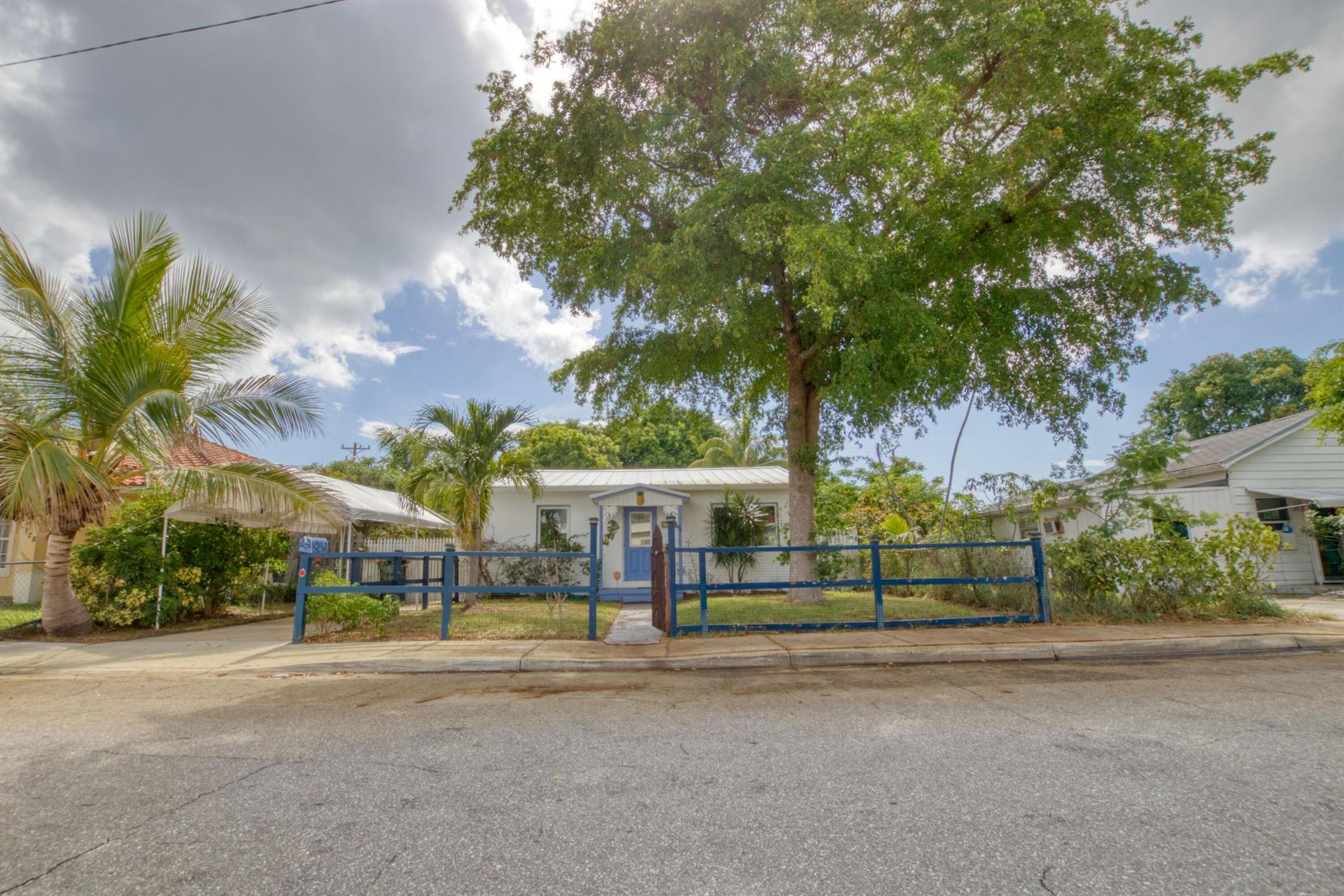 This home features a Fenced Double lot providing a Large Exterior Backyard for outside privacy. Nice sized bedrooms including an added Florida Room. A Garage Workshop with an additional carport. Outdoor shower & Cabana sitting area. Full sized Washer & Dryer with an extra Refrigerator in garage. All impact windows and doors. Avocado, Guava, Hayden Mango, Java Plum and Coconut trees!