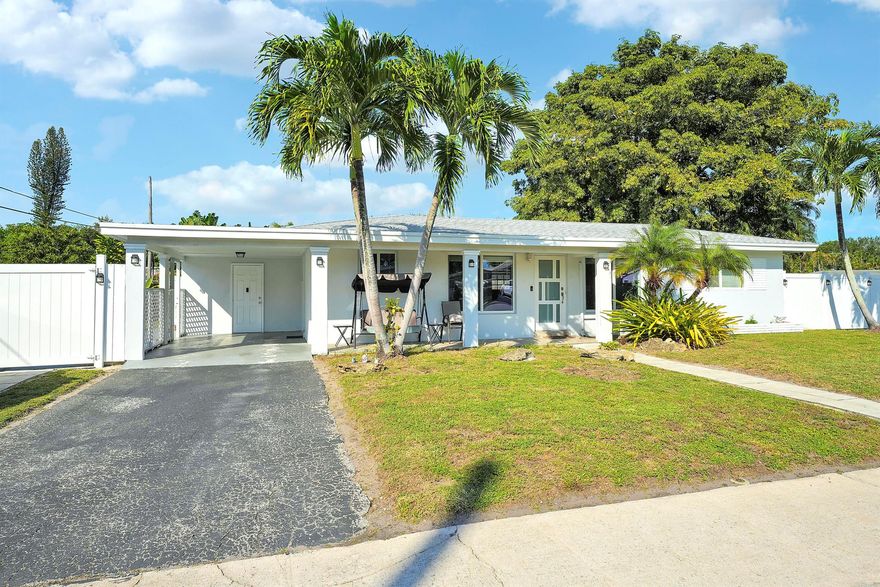 This updated home offers comfort, convenience, and peace of mind perfect for families, seasonal residents, or anyone seeking a low-maintenance Florida lifestyle. Upgrades include new roof, new air-conditioning system, and majority impact windows and doors providing excellent energy efficiency and storm protection. Inside, you will find a bright open living area, functional kitchen and split bedroom floor plan. The property sits on a generous lot, and features a fully fenced yard--ideal for pets, privacy, and outdoor living. In addition, the yard includes two double-gate entrances perfect for storing boats, trailers, work vehicles, or large equipment. Located minutes from I-95 and Turnpike, this home offers quick access to commuting routes, shopping, dining, and local amenities.