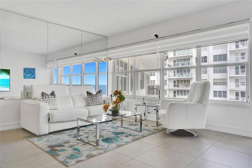Wait until you see the views from this penthouse beachfront condominium & the interior is just as impressive. Beautiful light gray matte porcelain tile w/a bit of texture creates an appealing pallet & improves safety should the tile get wet. The open kitchen has stainless steel appliances, pull-out pantry shelving, & horizontal grain kitchen cabinets making the design modern and natural. This same style is repeated in the bathroom creating a cohesive & modern feel to the home. Other features include a walk-in shower w/built-in niches, silhouette shades, & impact windows & door. Royal Ambassador is located directly on the beach and is situated for shopping. dining and health needs are all within comfortable walking distance.  The building is currently undergoing concrete restoration.