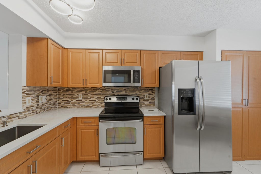 Photo of 6093 POINTE REGAL Circle #209, Delray Beach, FL 33484 (MLS # B26071398)