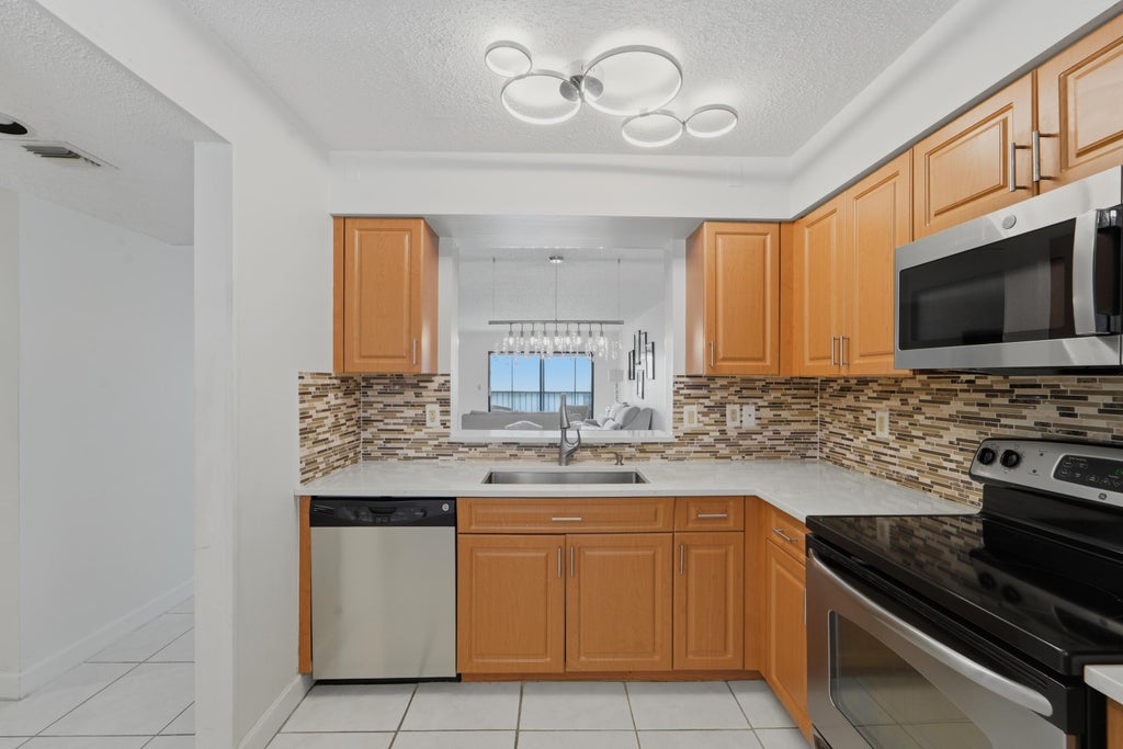 Photo of 6093 POINTE REGAL Circle #209, Delray Beach, FL 33484 (MLS # B26071398)