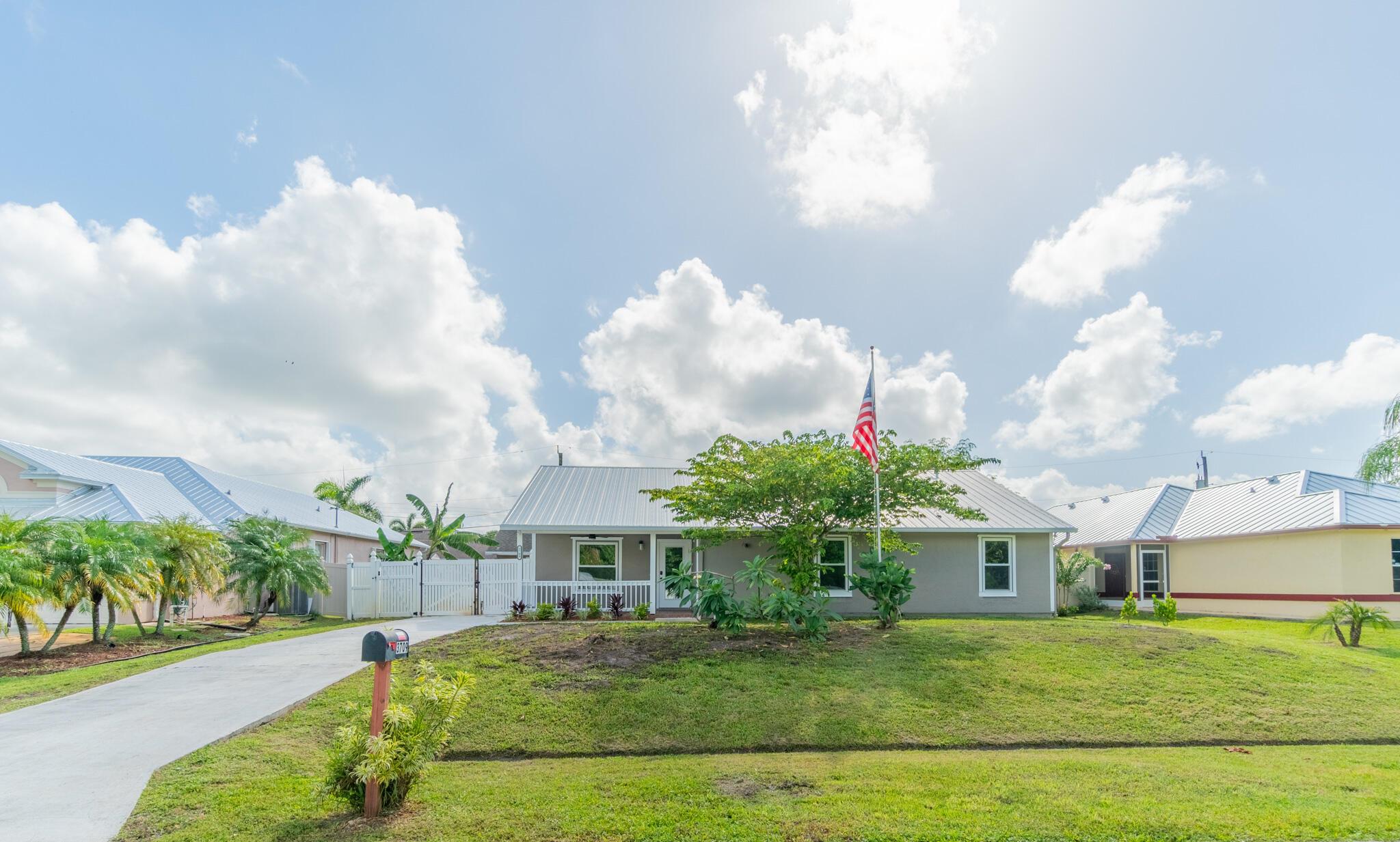 Assumable mortgage at 3.75%! This spacious 5 bed / 3 bath main home offers 2,589 sqft plus a detached 1 bed / 1 bath guest house with approx. 400 sqft. Located on a fully fenced lot, the property features all new impact windows and doors, 2019 metal roof, and fresh interior and exterior paint. Inside you'll find a modern kitchen with new appliances, high-hat lighting, upgraded ceiling fans, and stylish wall sconces. Main home A/C from 2021, guest house has a new unit, and back rooms have a separate 1.5-ton A/C. Guest house features antique wood French doors and private A/C. Motion lights, new porch fan, and more. Perfect for multigenerational living, rental income, or a private retreat!