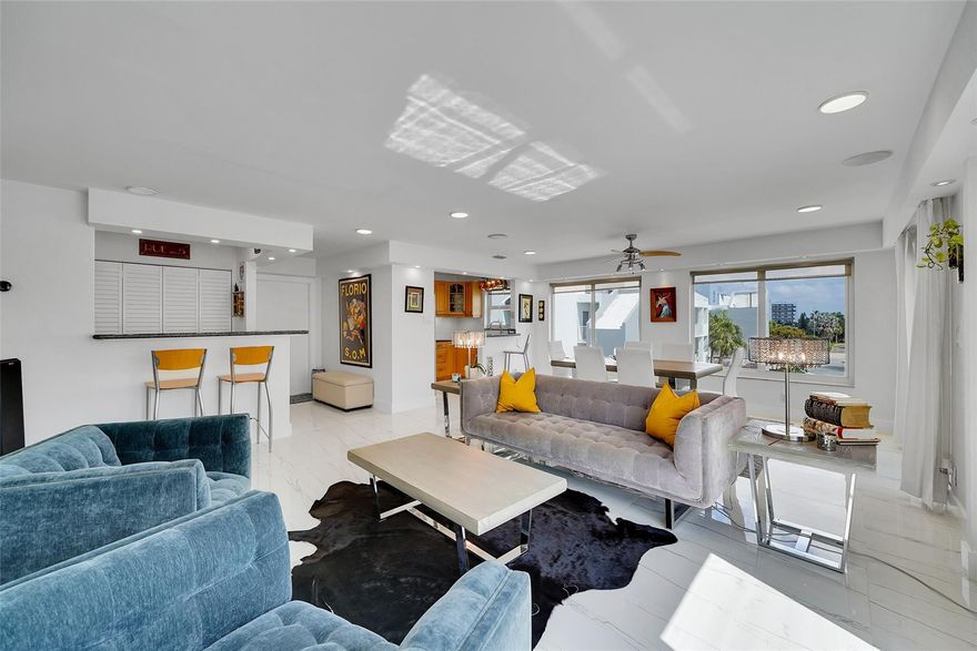 Rarely Available Penthouse with Incredible WATER VIEWS! Best of all walking distance to the BEACH. DOCK AVAILABLE FOR RENT. Step into luxury living with this spacious, remodeled unit, truly one of a kind and rarely available. Surrounded by Impact windows on all sides, this condo offers Great water views and the best in the building day or night. Enjoy indoor-outdoor living with your private balcony, perfect for morning coffee or evening snacks. The open-concept layout features stainless steel appliances, modern finishes, and comes fully furnished, ready to move-in. Brand-new impact windows, new electrical panel, well-maintained AC unit only 5 years old, Appliances about 5 ys old for peace of mind. This penthouse is a rare gem that blends comfort, style, and great views. Internet included