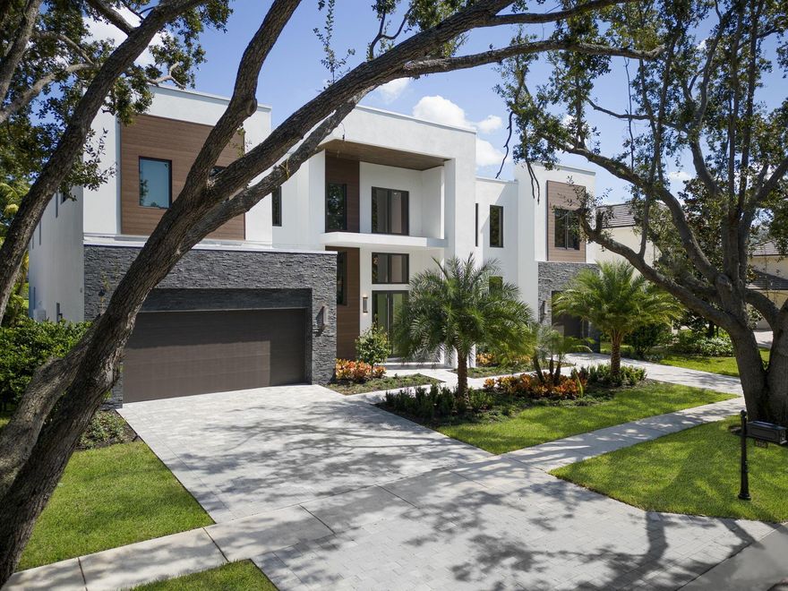 Stunning newly built home, located lakeside within the prestigious Hamptons of Woodfield Country Club. This contemporary masterpiece boasts 5 BD, 5.1 BA, loft, study, club room, and elevator ready - designed to elevate your lifestyle. The gourmet kitchen features top-of-the-line appliances and a dedicated wine room, opening up to the remarkable family and living room, making it ideal for hosting intimate gatherings or grand dinner parties. Step outside to your private oasis, where a heated pool, spa, and fully equipped summer kitchen await.With over 6,000 SF of meticulously crafted living space, this home offers ample room for everyone with too many upgrades to mention. The split 3-car garage provides storage space for your vehicles. Welcome to the epitome of opulence & comfort