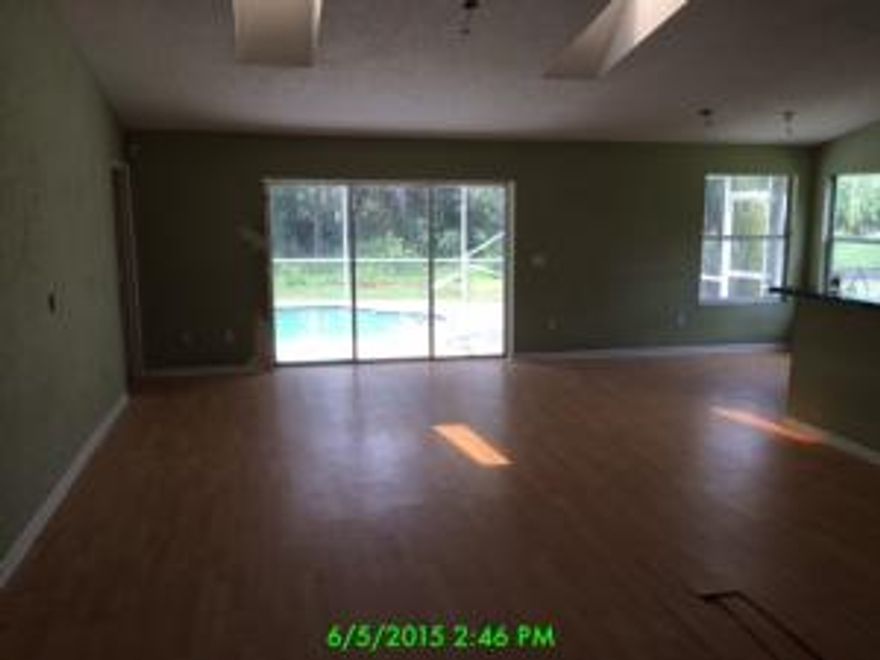 Nice home with a great layout with screened in pool. This one will not last long at this price. Make your arrangements to see this home today before it is too late!