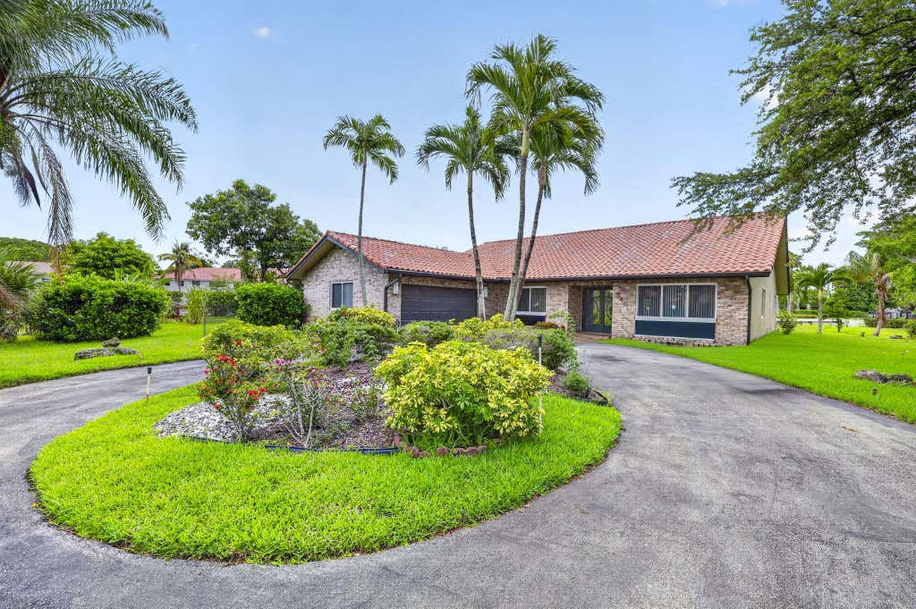 Photo of 2403 NW 118th Terrace, Coral Springs, FL 33065 (MLS # B26038677)