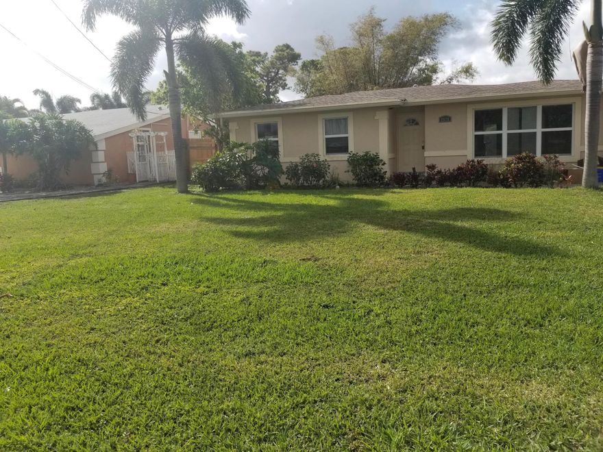 Updated 2 bedroom, 1 bath single family home centrally located in West Palm Beach. Granite countertops and stainless steel appliances in kitchen. Tile and laminate flooring throughout. Garage has been converted into a storage room and utility room. Spacious back yard and pet friendly!
