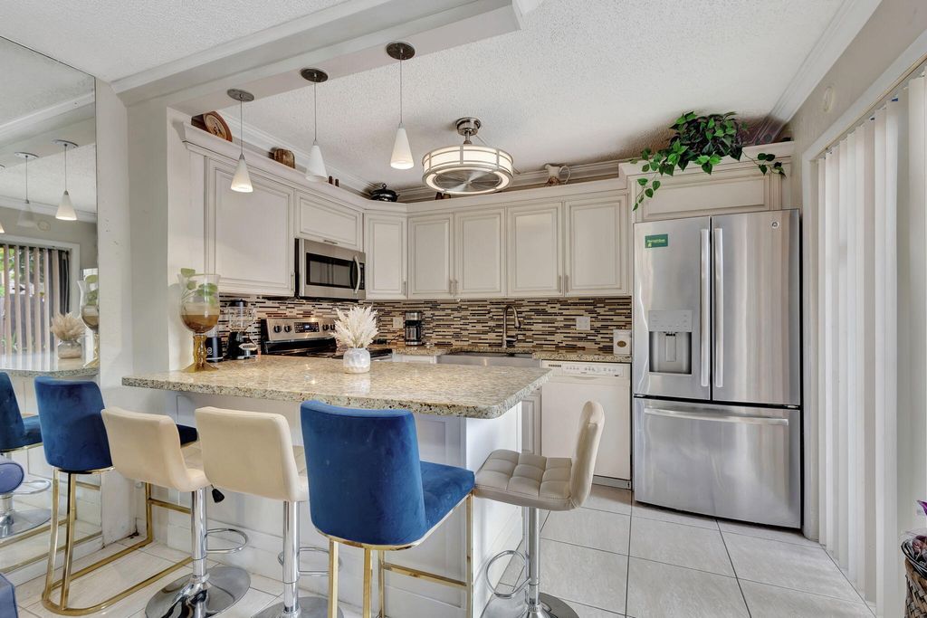 Photo of 247 Lake Arbor Drive, Palm Springs, FL 33461 (MLS # R11028716)