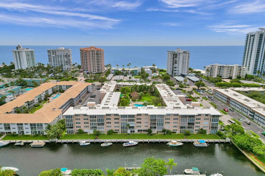 South Florida at its best! along with the 40 Yr Certification is done.  Remodeled to perfection. The open-concept living area is perfect. The kitchen has been tastefully remodeled, equipped with SS Applicances and stylish soft close cabinetry. This stunning 1 bedroom 1 bath condo is situated across the street from the breathtaking South Florida Beaches and provides private beach access. Prime location offers unparalleled coastal living. Easy access to the mesmerizing waterways with no fixed bridges, provides endless boating adventures. Owners can apply for the 32 ft COMMON DOCK SPACE when available, Community pool, putting green, grill area, shuffleboard and laundry room. Low assocation fee includes INSURANCE, and repair on A/C and much more.