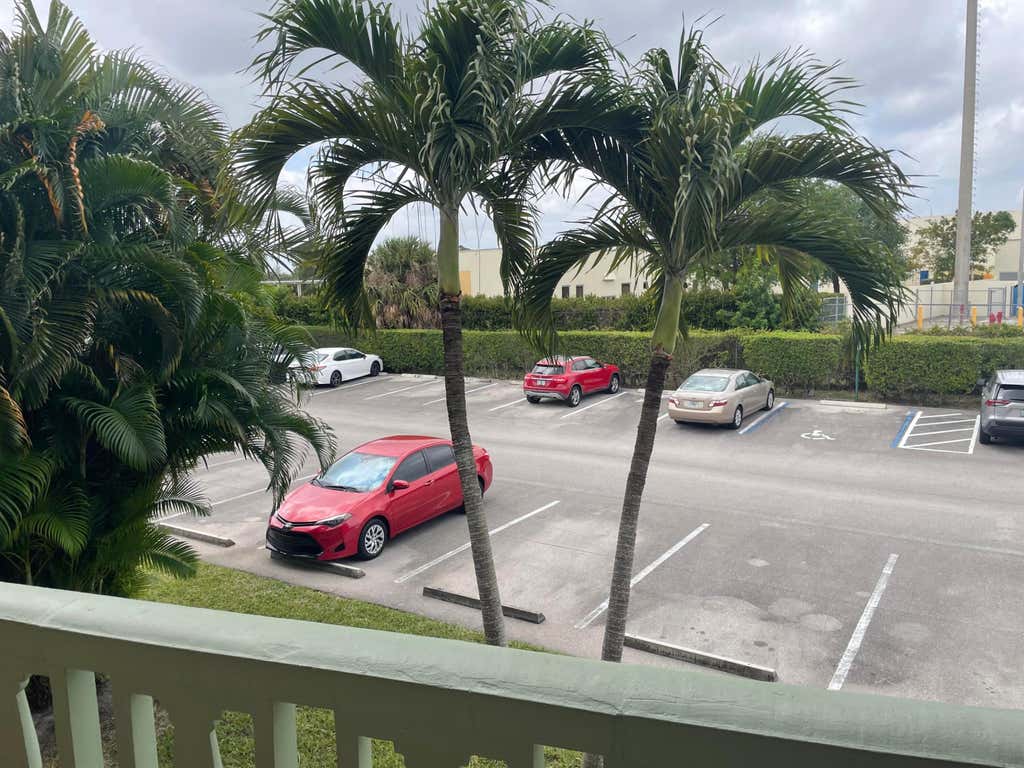 Photo of 400 Village Green Circle W #202, Palm Springs, FL 33461 (MLS # B26058513)