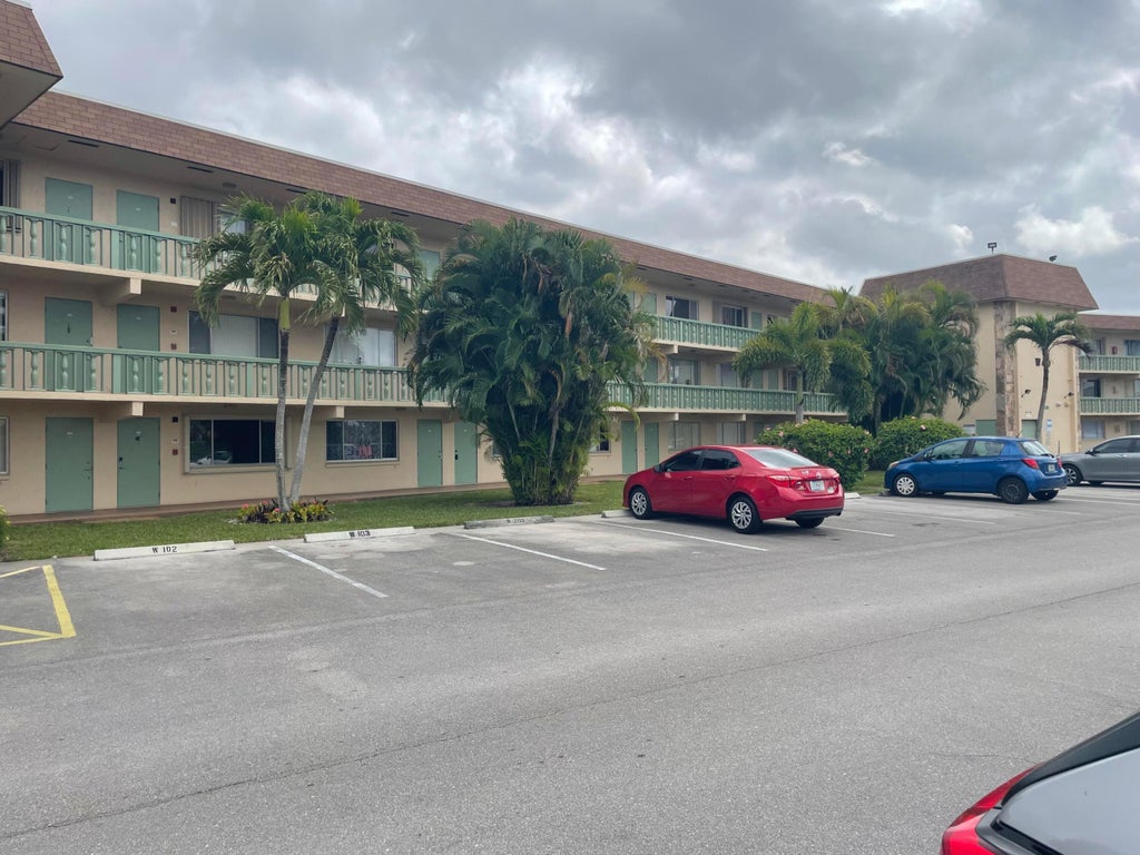 Photo of 400 Village Green Circle W #202, Palm Springs, FL 33461 (MLS # B26058513)