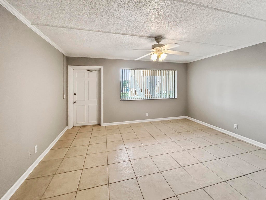 Photo of 400 Village Green Circle W #202, Palm Springs, FL 33461 (MLS # B26058513)