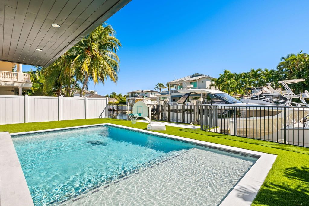 Photo of 710 NE 69th Street, Boca Raton, FL 33487 (MLS # F10531833)