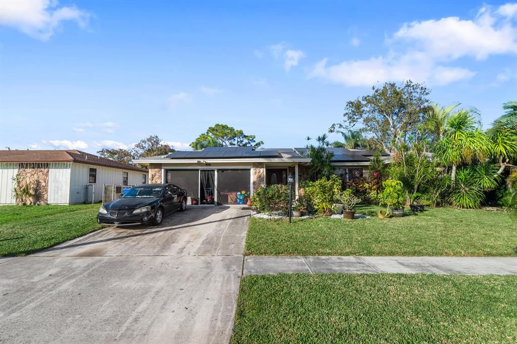 Photo of 2604 Doral Way, Riviera Beach, FL 33407 (MLS # R10854368)