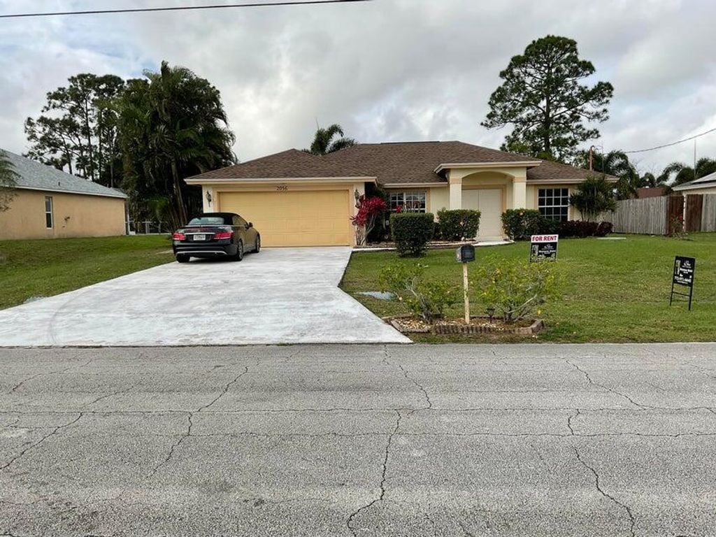 Photo of 2056 SW Idaho Lane, Port Saint Lucie, FL 34953 (MLS # R11163205)