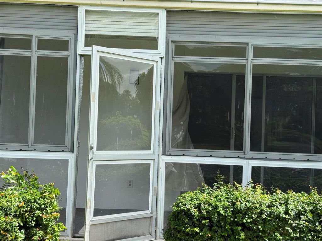 Photo of 4302 Martinique Cir #H1, Coconut Creek, FL 33066 (MLS # F10527927)