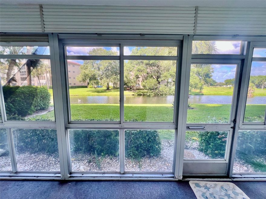 Lowest price 1-bedroom, 1.5-bath unit. Water view. This ground floor unit features a new air conditioning system, an updated shower with a glass enclosure, and extended kitchen cabinets for extra storage. Enjoy a dome bright kitchen ceiling & ceiling fan in the kitchen & bedroom, carpet in the bedroom, and tile throughout the rest of the space.  Enclosed plexiglass patio enclosure Located within walking distance to the theater, fitness center, and BBQ & in short walking distance to: Ave of the Stars,Clubhouse,Restaurant & Golf Course. . Enjoy amenities like a state-of-the-art fitness center, Café on the Green coffee shop, health services, and no golf club membership requirement. Just 6 miles from beautiful beaches.  55+ Fico score at least 700 Good income required.