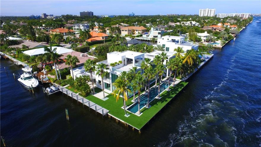 Stunning contemporary SE point by Bomar Builders!Sophisticated South Beach flair, top quality construction & custom finishes.A residence full of Florida sunshine & open space. Expansive living areas open to multiple covered loggias, floor-to-ceiling windows capture magnificent open intracoastal views. 1st Level: kitchen, breakfast, family & living rooms, library/media + VIP guest suite & bedroom suite. Level 2: Ultra luxurious master, balcony,loft area & 2 bedroom suites. Level 3:Expansive rooftop terrace