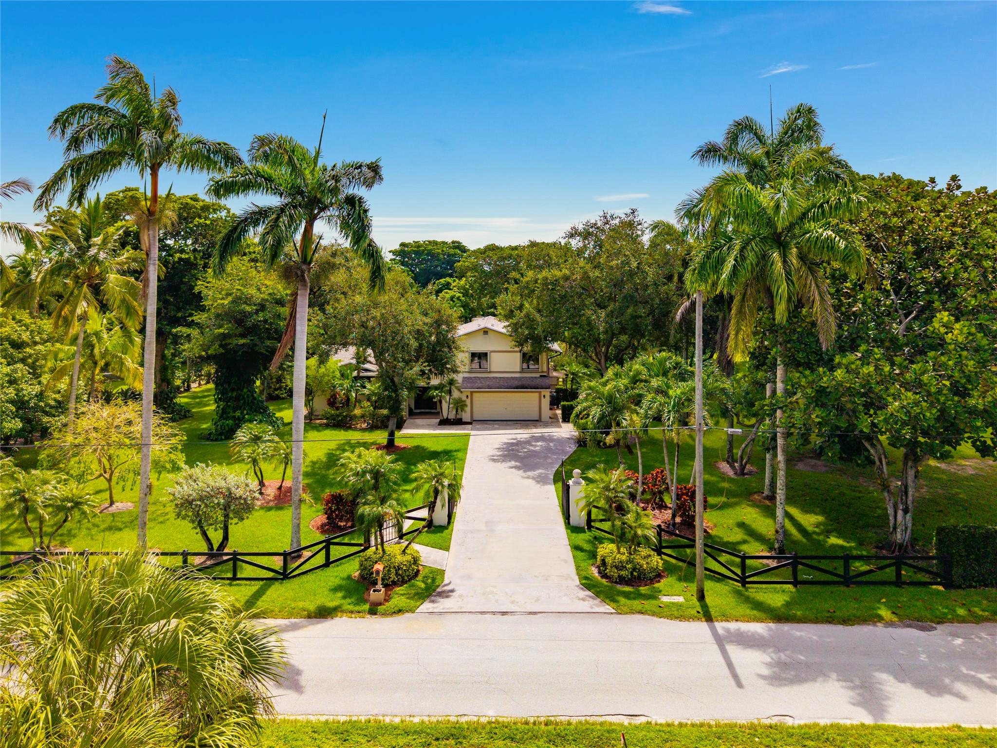 A perfect blend of peaceful country living and everyday convenience in this beautifully maintained 4/3 home, set on 2.5 acres of lush, landscaped grounds with mature fruit trees and open green space. This private retreat offers tranquility just minutes from top-rated schools, shopping, and dining. Ideally located only a quarter-mile from Barkland Dog Park and the Parkland Equestrian Center. Note: on-premises stables are not included but negotiable in rental. Spacious living areas with generous natural light, a well-appointed kitchen ideal for cooking and entertaining, and a seamless flow between indoor and outdoor living. Step outside to enjoy your own heated pool, perfect for relaxing or hosting friends year-round. This Parkland gem offers comfort, charm, and a lifestyle you’ll love!