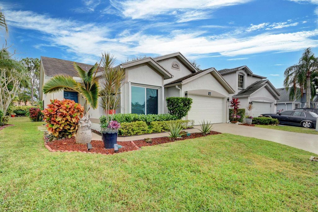 Photo of 121 Hammocks Drive, Greenacres, FL 33413 (MLS # R10957329)