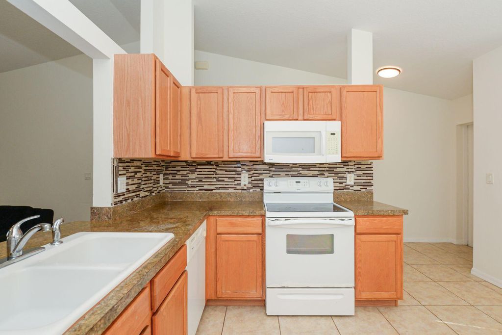 Photo of 885 SW Sultan Drive, Port Saint Lucie, FL 34953 (MLS # R11102317)