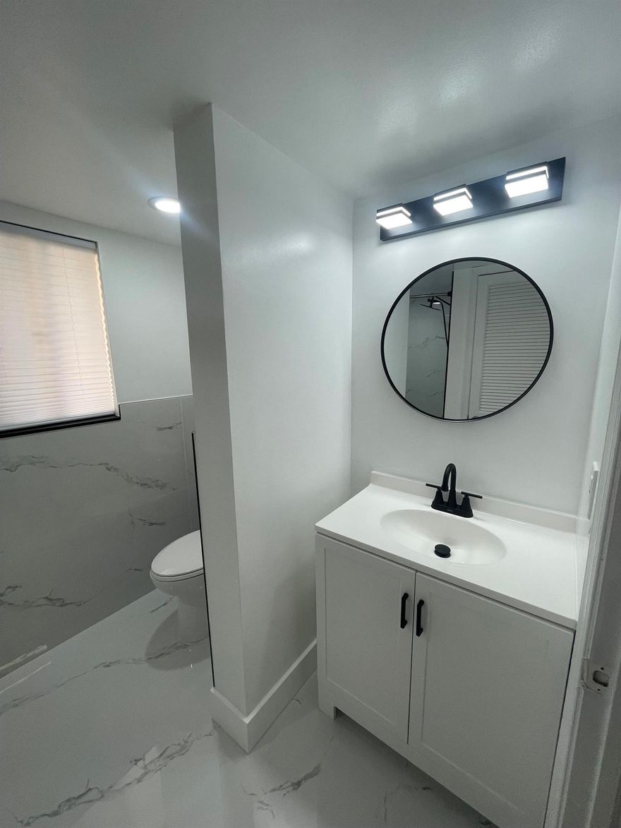 LOCATION LOCATION! This completely updated condo is located right off of I-95 centrally located to everything!Steps away from Costco, JFK Hospital & 5 minutes to the beaches/ ocean & downtown Lantana/ LWB's night life & entertainment!This condo has been completely gutted & updated with high end finishes & a clean modern look! Sip your coffee every morning overlooking the beautiful greenery (looks like a golf course) & community pool on your oversized screen-in patio! This large 2 bed 2 full bath condo has everything you need & located in a great community with strong financial reserves- no special assessments! The roof is currently being redone. Perfect home for any first time buyer & great for investors to rent it up to 2 times a year-traveling nurses/seasonal renters