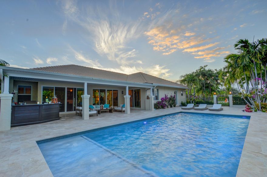 An ideal blend of rustic and transitional styles, this beautiful residence sits on 5.45 acres with a completely redone home features a split bedroom floor plan with sloped ceilings and decorative ledges that add interest to every room. The space boasts a formal dining area and eat-in kitchen, with Carrara marble countertops and stainless steel appliances. In the master bedroom, separate shower, dual sinks, and a sitting area are standout attributes. 
Outside, the covered French travertine patio, outdoor kitchen and heated saltwater pool look onto the 8 stall center aisle barn. The property also features a 135'x230' riding arena with all-weather sand textile mix and surround sound, a grass riding area, and 7 paddocks. A short hack away from show grounds, this estate will delight any equestrian. Site work has been done and plans are approved to renovate the 8 stall barn to 12 stalls with two additional wash stalls and staff apartment.